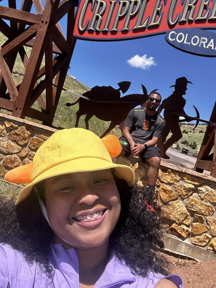 Ayesha wearing her carrot bucket hat outdoors