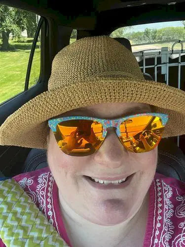 Sarah wearing a mouldable-brim straw hat
