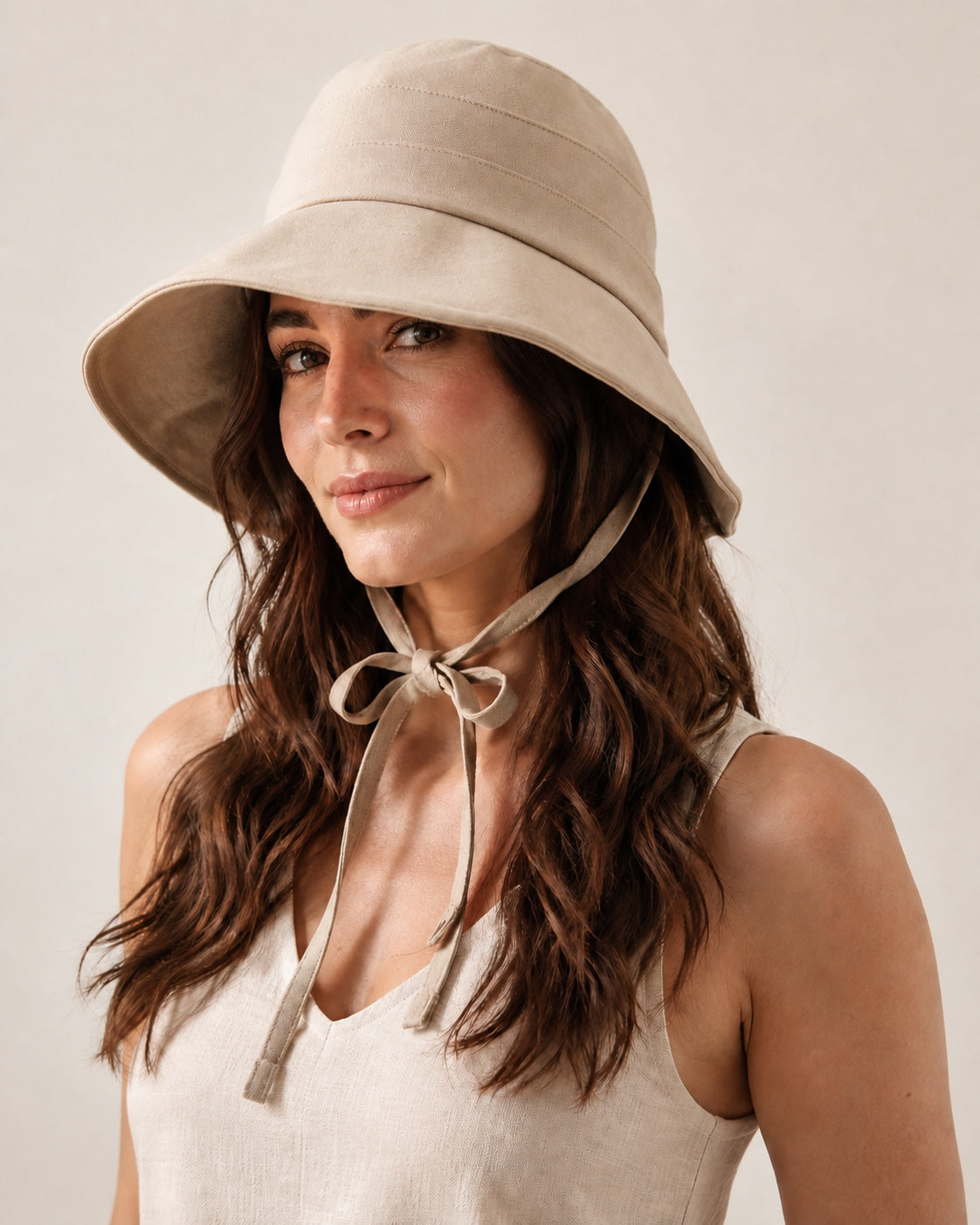 Beige breathable bucket hat worn by model