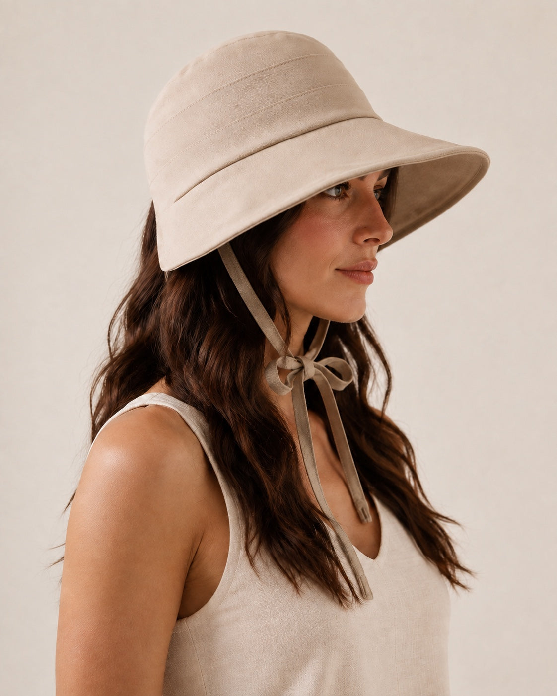 Side profile of beige summer bucket hat