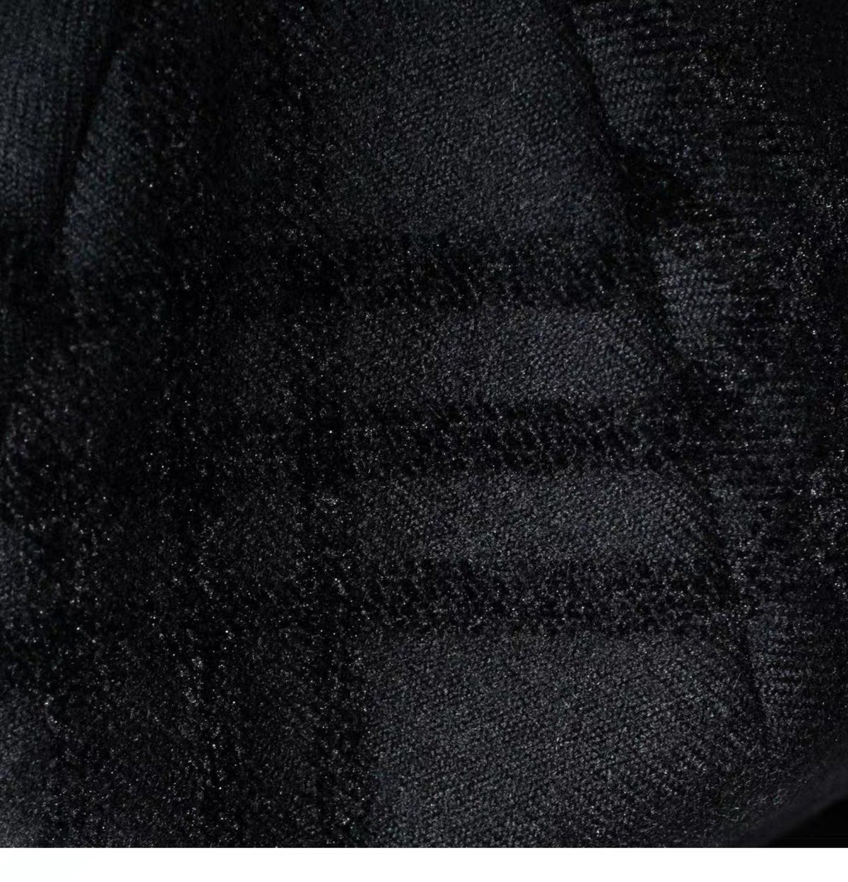 Close view of the black fine woven wool surface