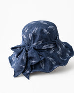 Navy feather-print bucket hat with back bow detail