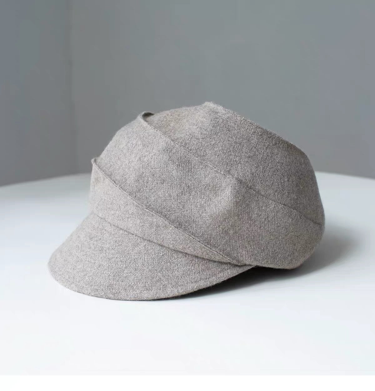 Beige sculpted wool newsboy cap, three-quarter product view