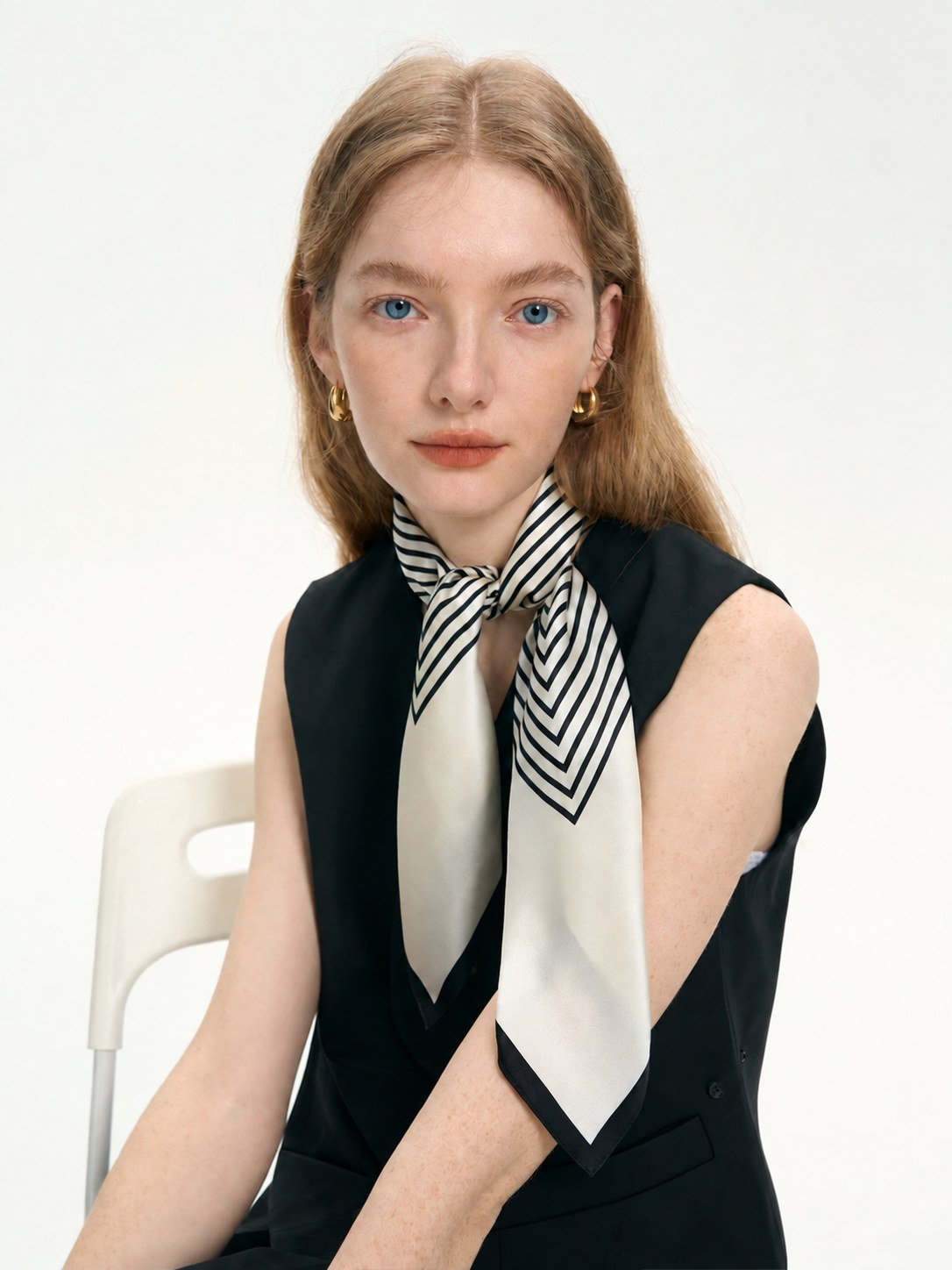 Simple Stripe 65cm mulberry silk square scarf knotted at the neck on a seated model