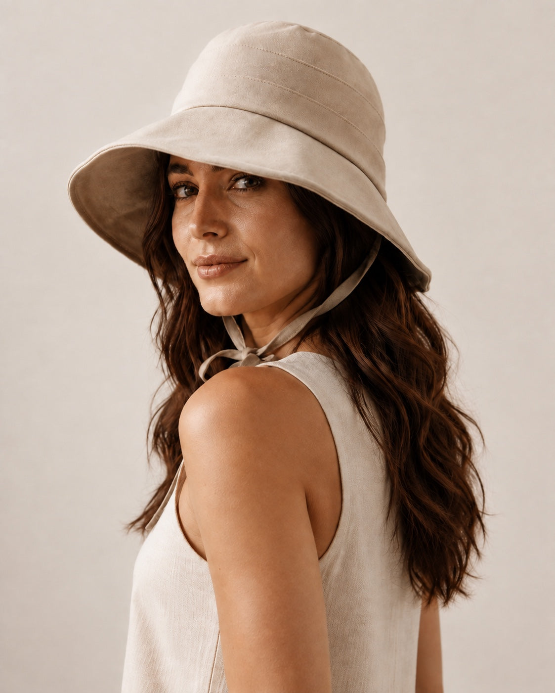 Rear three-quarter view of beige bucket hat