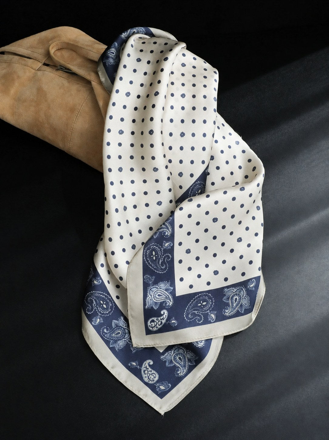 Navy Dot Paisley 65cm mulberry silk square scarf draped beside a tan suede bag