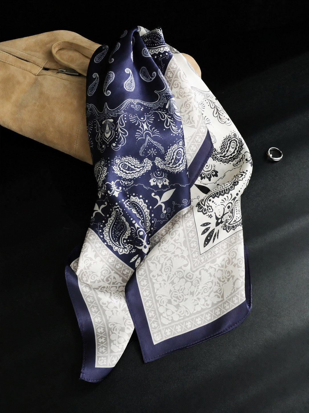 Navy Two-Tone Paisley 65cm mulberry silk square scarf draped beside a tan suede bag