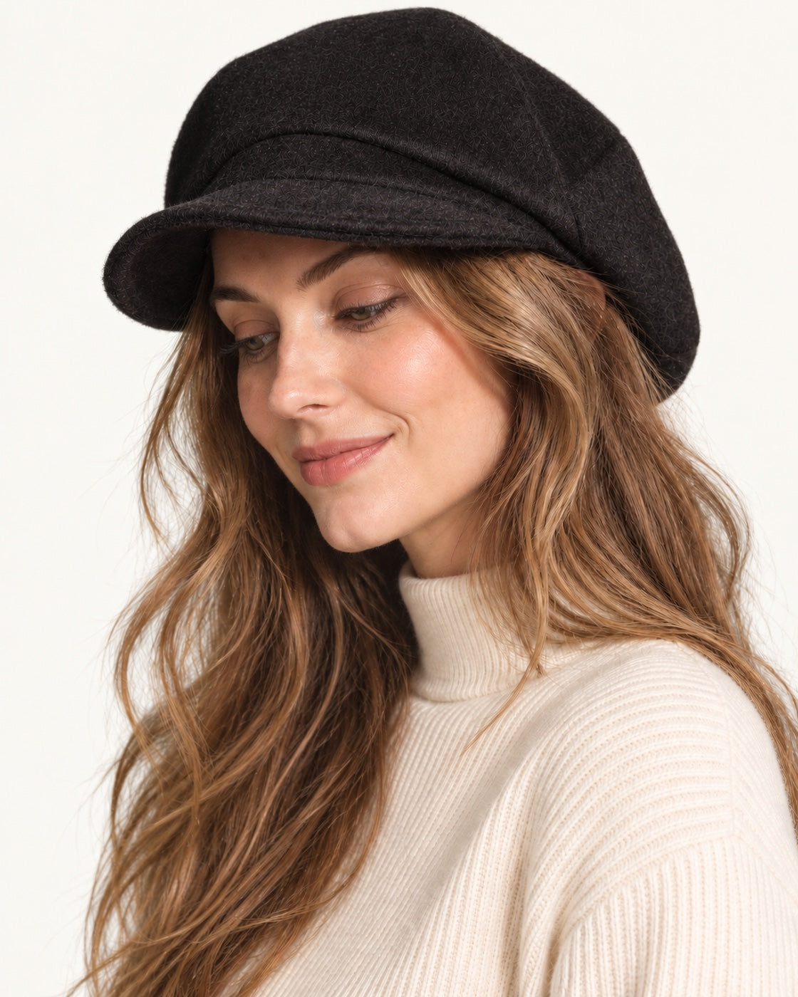 Black 100% wool 5-way cap worn by a smiling model, three-quarter view