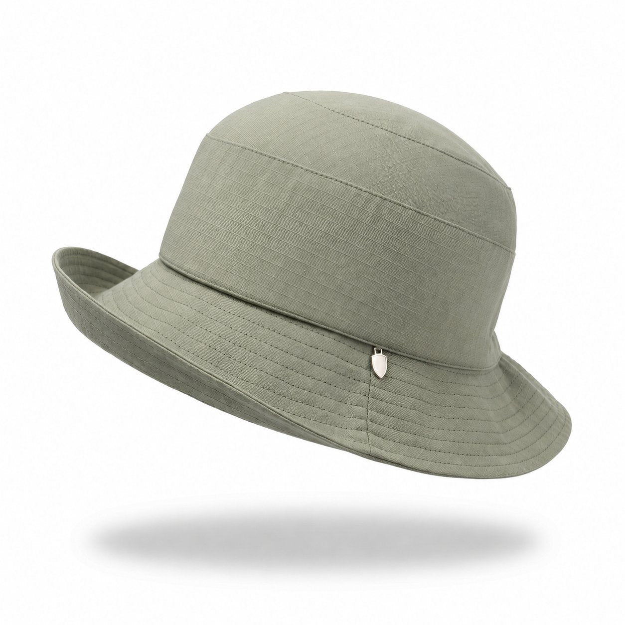Sage green cotton bucket sun hat, angled view