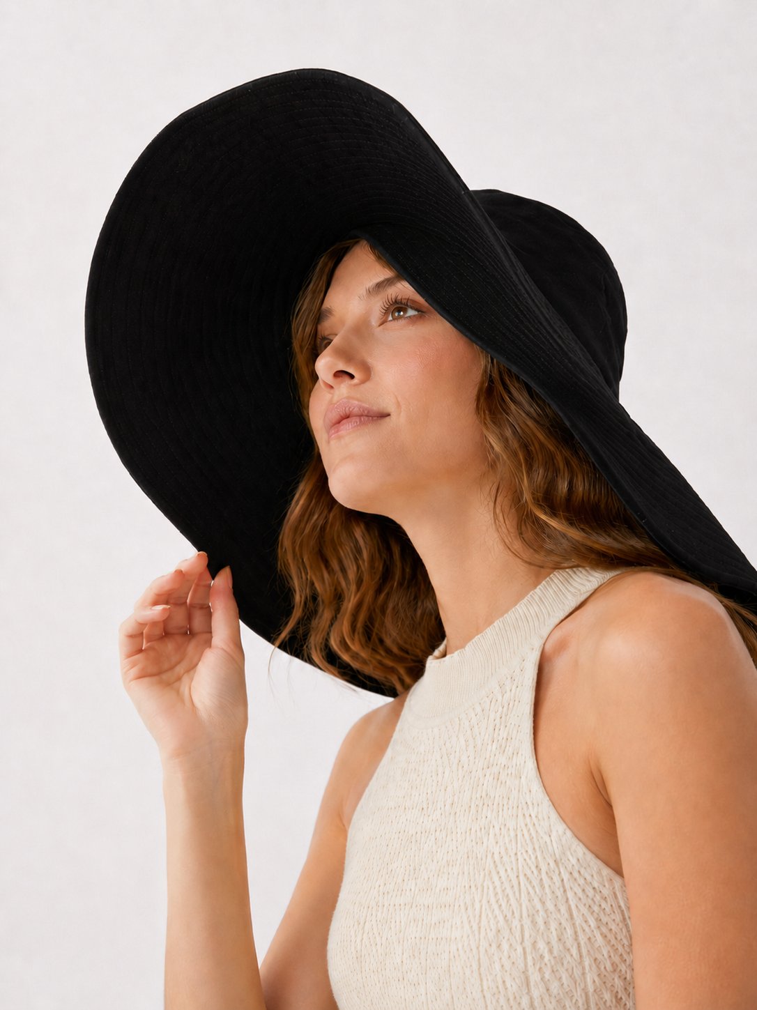 Black oversized wide-brim sun hat on model