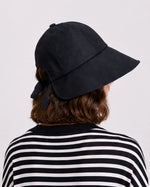 Back view of linen sun hat showing bow and buckle adjuster