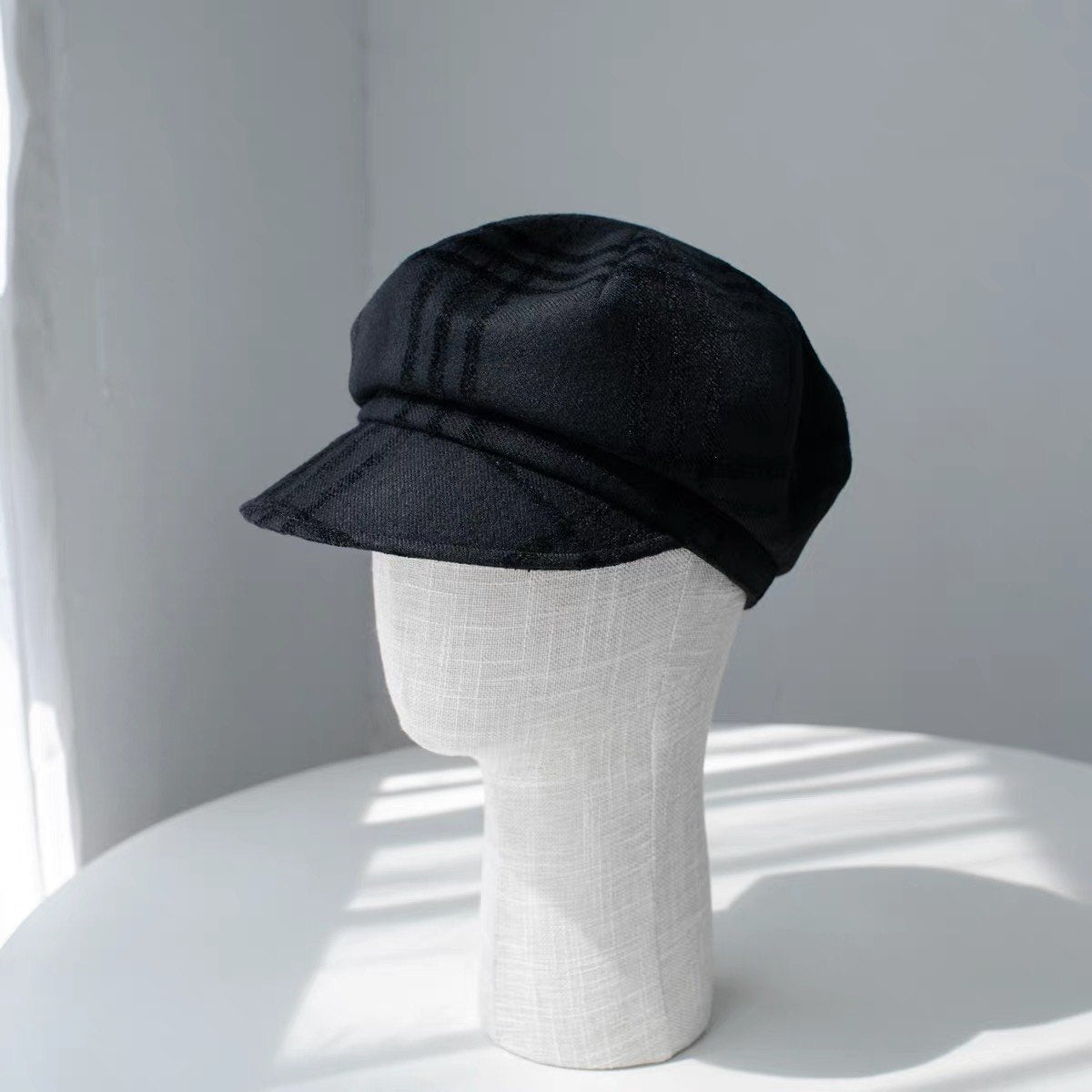 Black fine woven wool newsboy cap product view