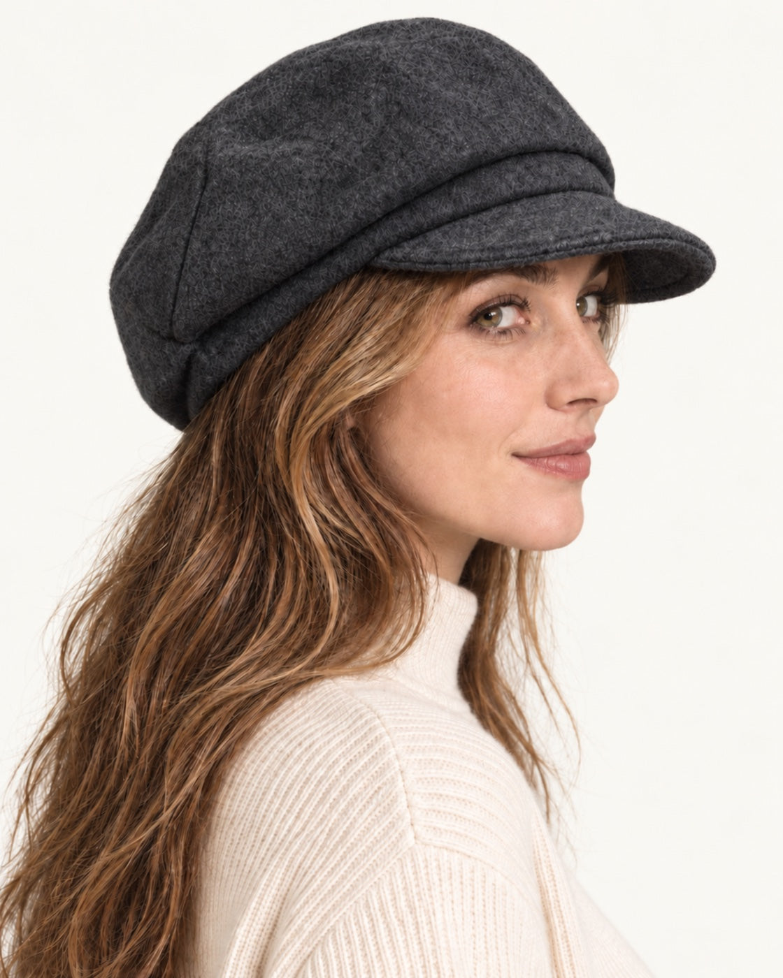 Dark gray 100% wool 5-way cap worn by a smiling model, side profile