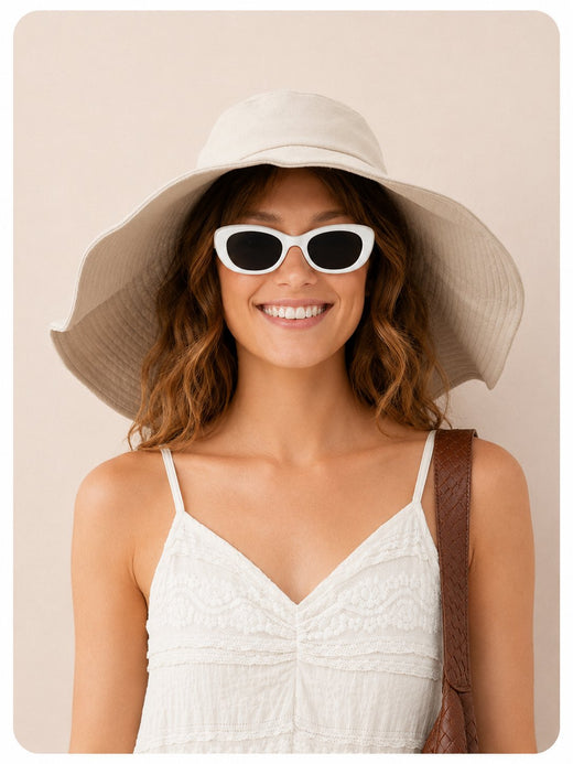 Model in cream cotton wide-brim sun hat, angled view