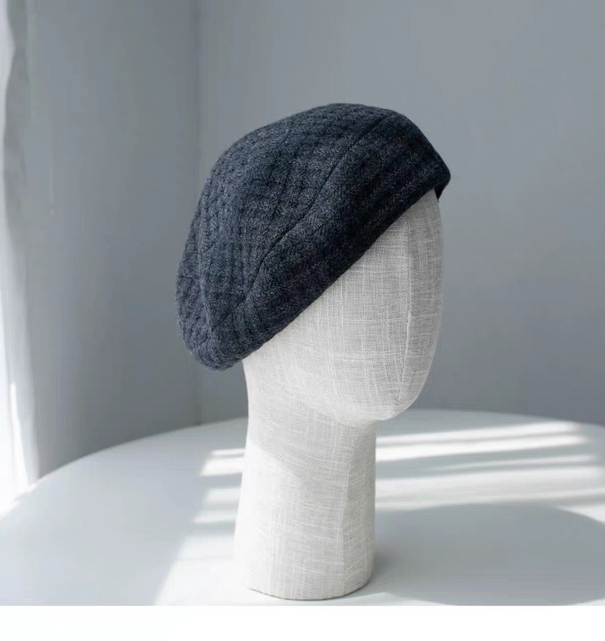 Charcoal gray structured wool beret shown from the front right