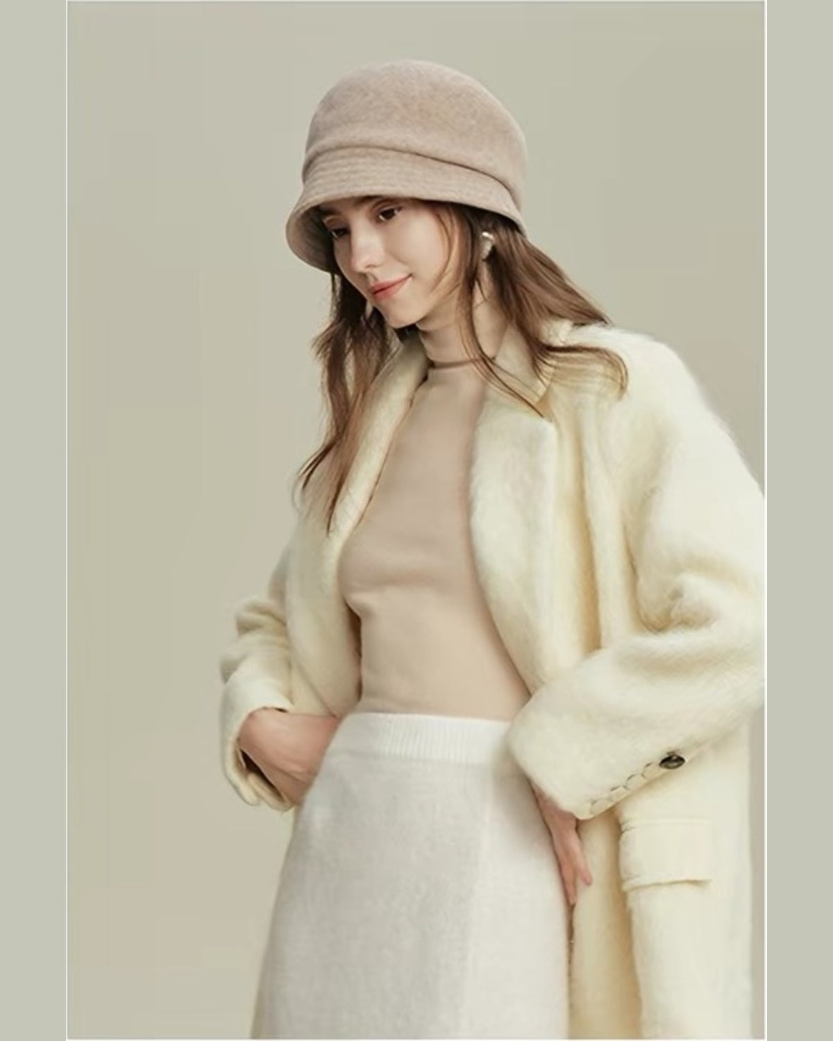 Beige wool cloche hat styled with a cream winter outfit