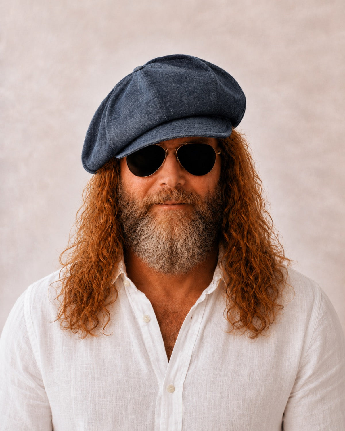 Man wearing dark denim linen newsboy baker boy cap
