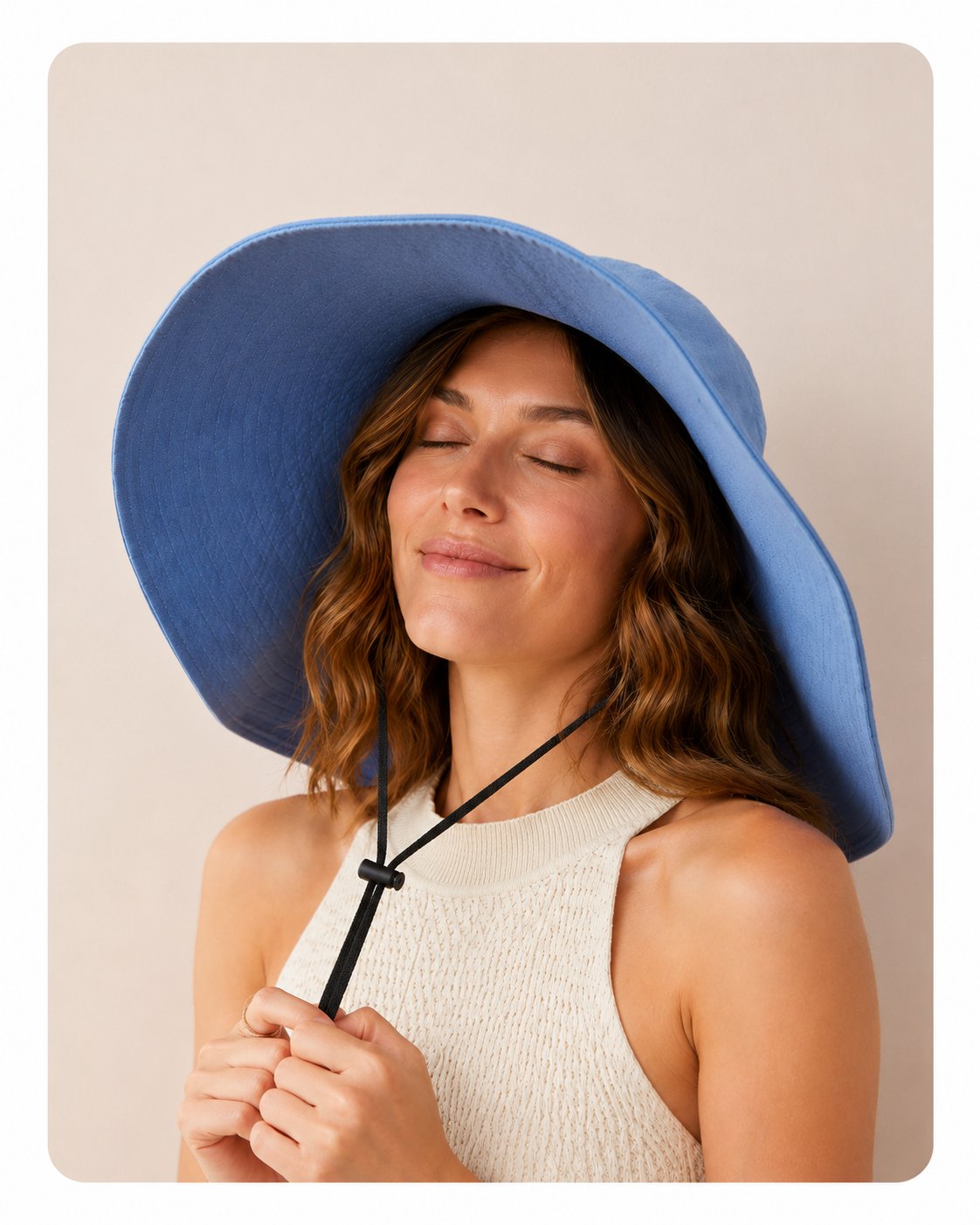 Blue 15cm wide-brim sun hat with windproof cord on model