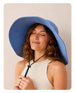 Blue 15cm wide-brim sun hat with windproof cord on model