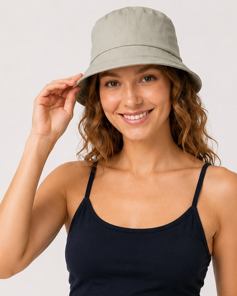 Close front view of model in sage green cotton sun hat
