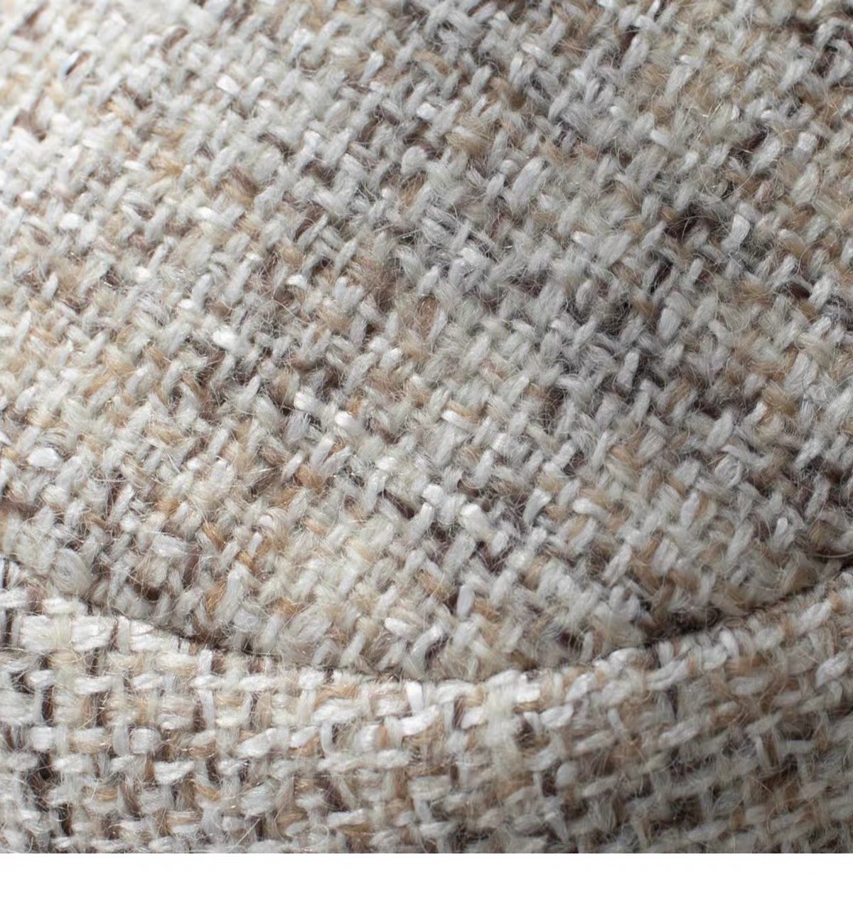 Close view of the beige woven wool texture