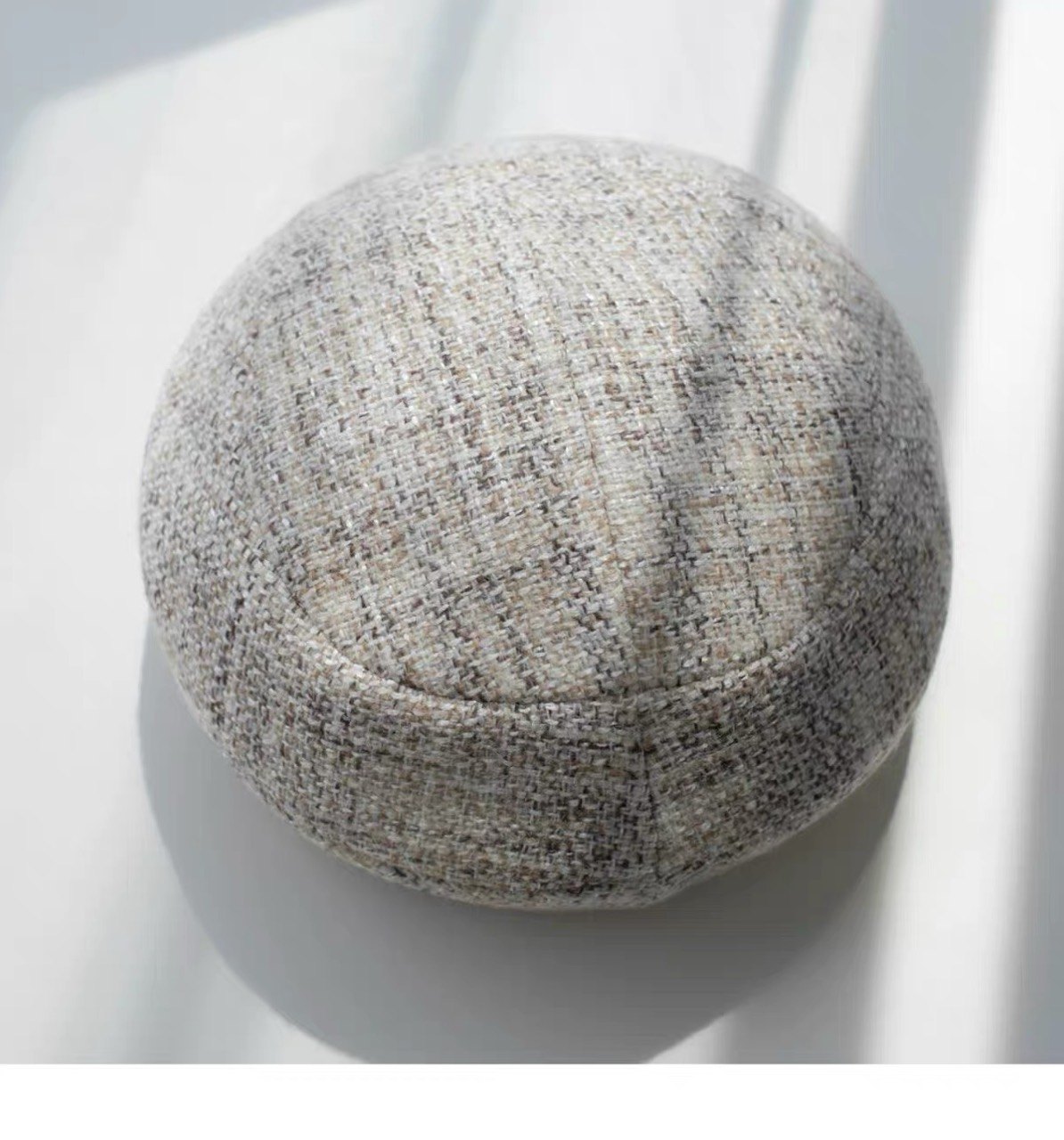 Top view of the beige structured wool beret