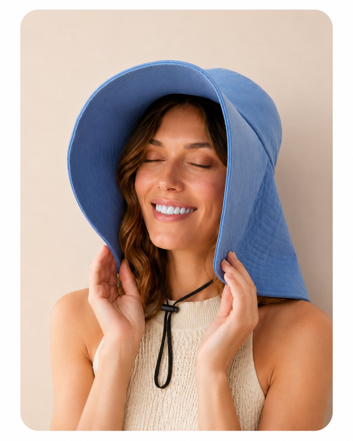 Woman in blue wide-brim sun hat, front view