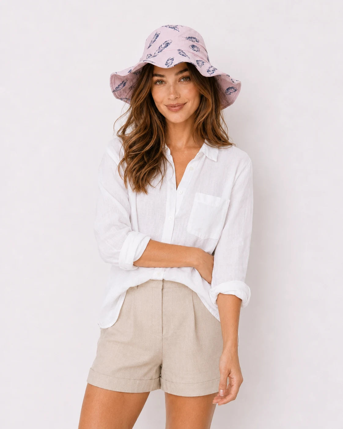 Woman wearing pink feather-print bucket hat