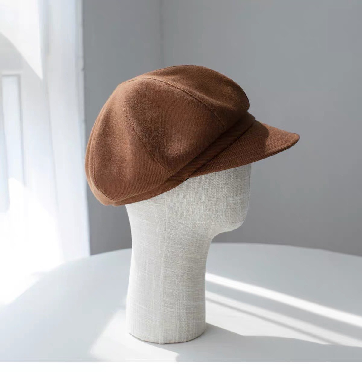 Rear view of the brown fine woven wool newsboy cap