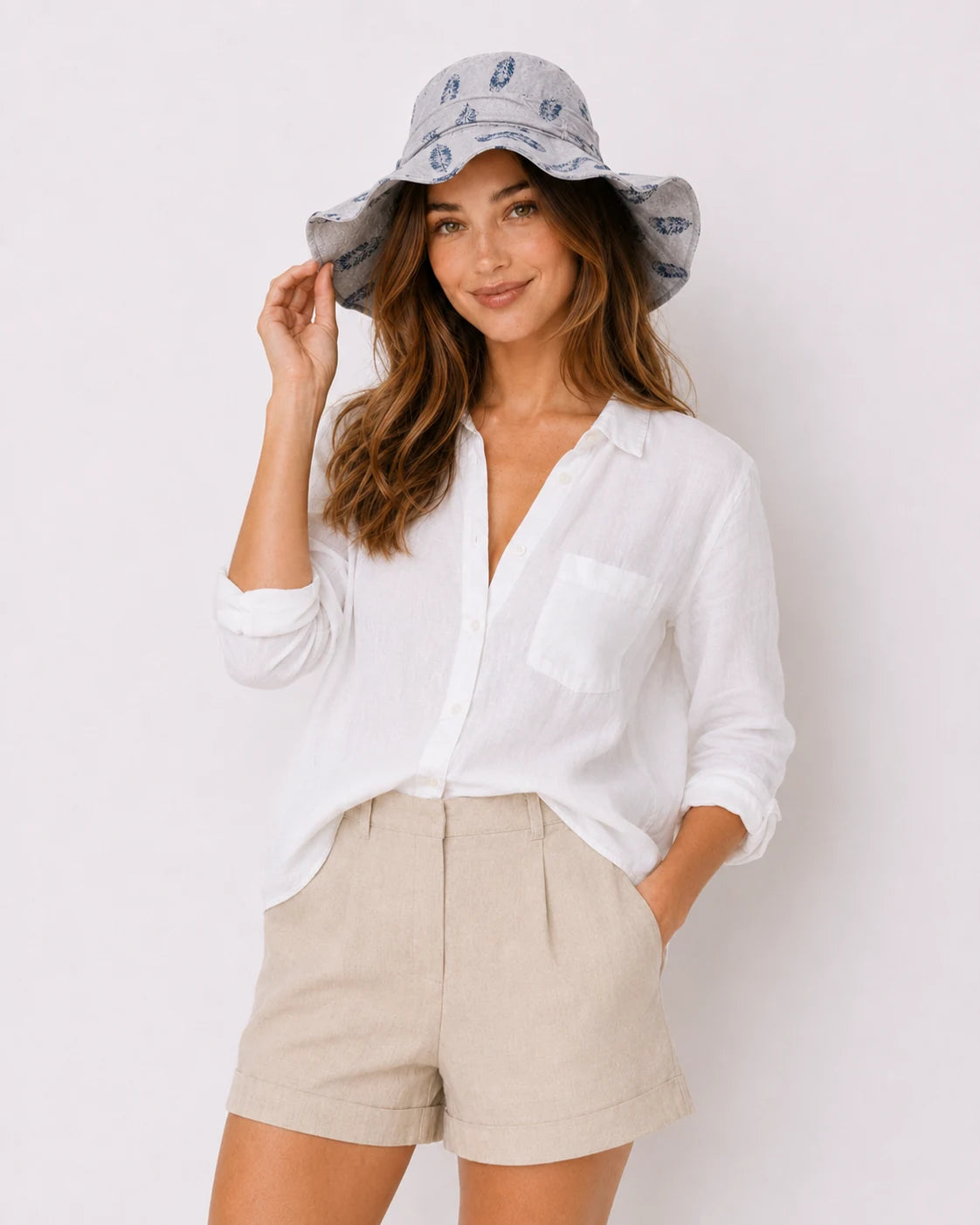 Woman wearing gray feather-print bucket hat