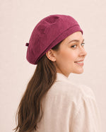 Woman wearing dark pink cotton linen French beret