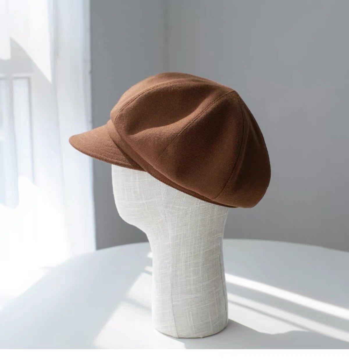 Brown fine woven wool newsboy cap shown from the right rear