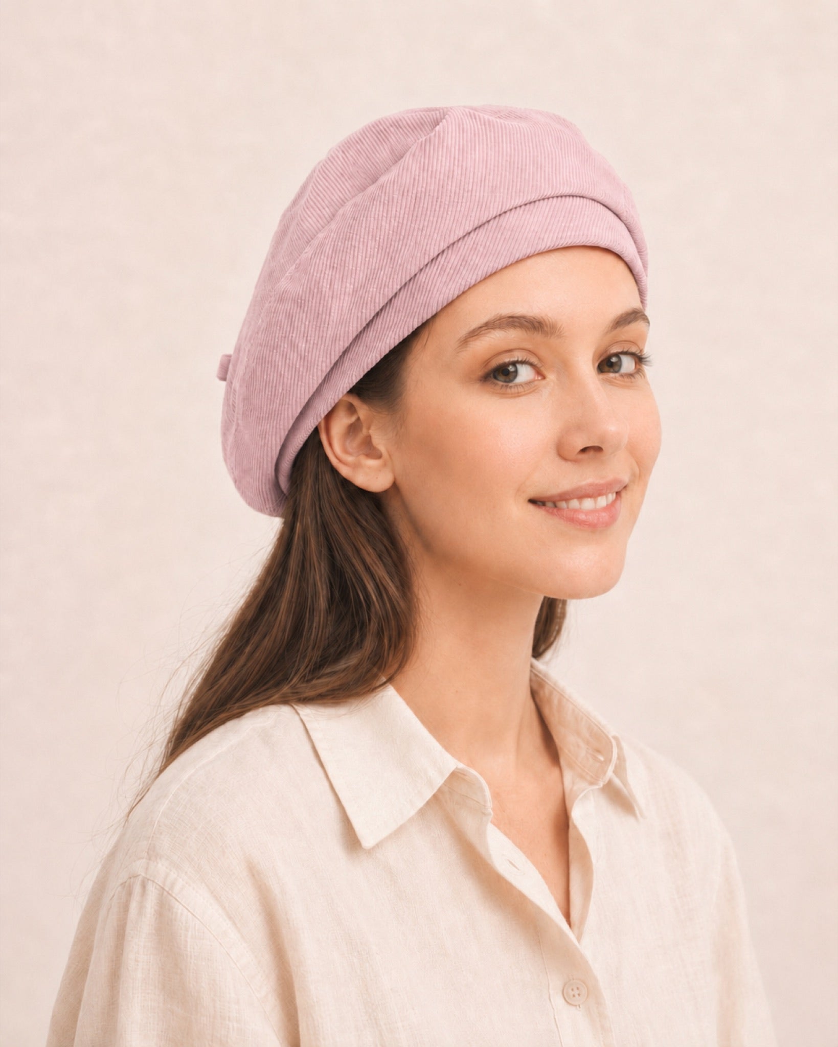 Woman wearing light pink cotton linen French beret