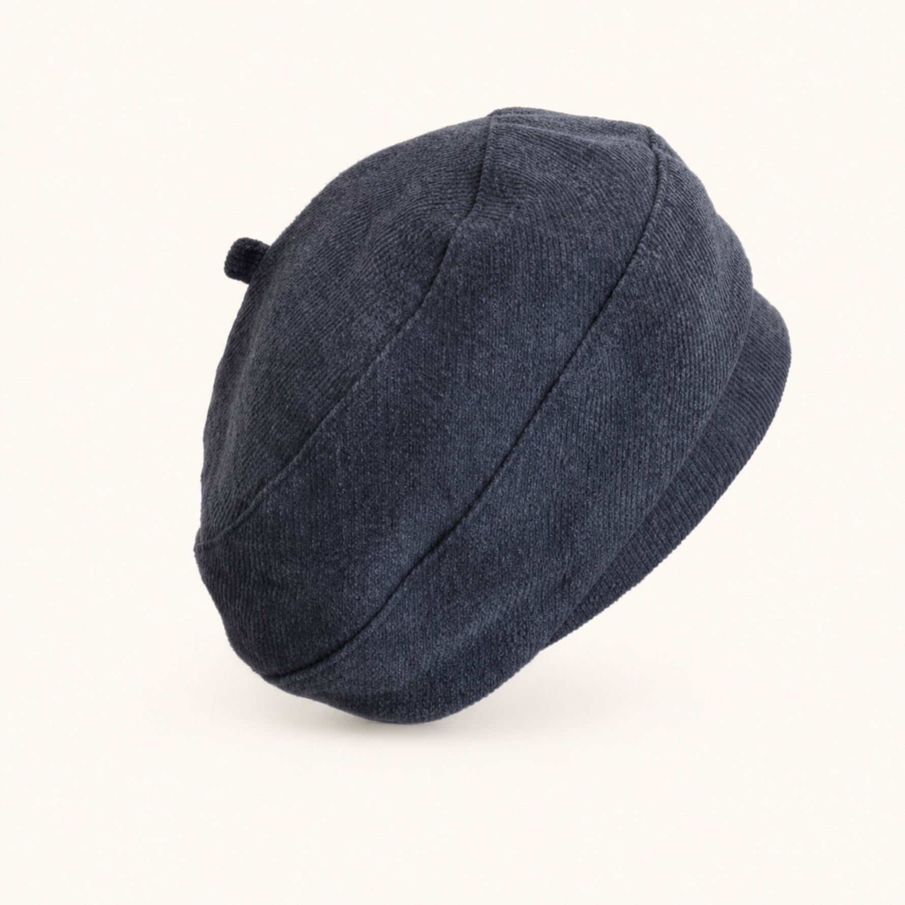 Woman wearing navy cotton linen French beret