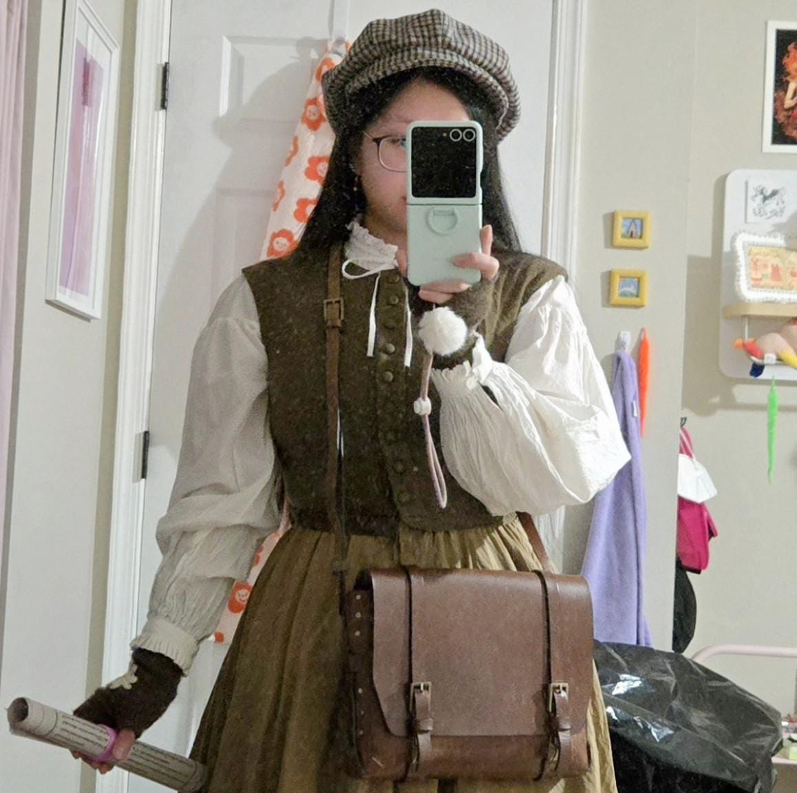 Customer wearing plaid cotton newsboy cap — Dickens Festival costume