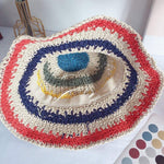 Rainbow straw hat interior view showing size band and construction