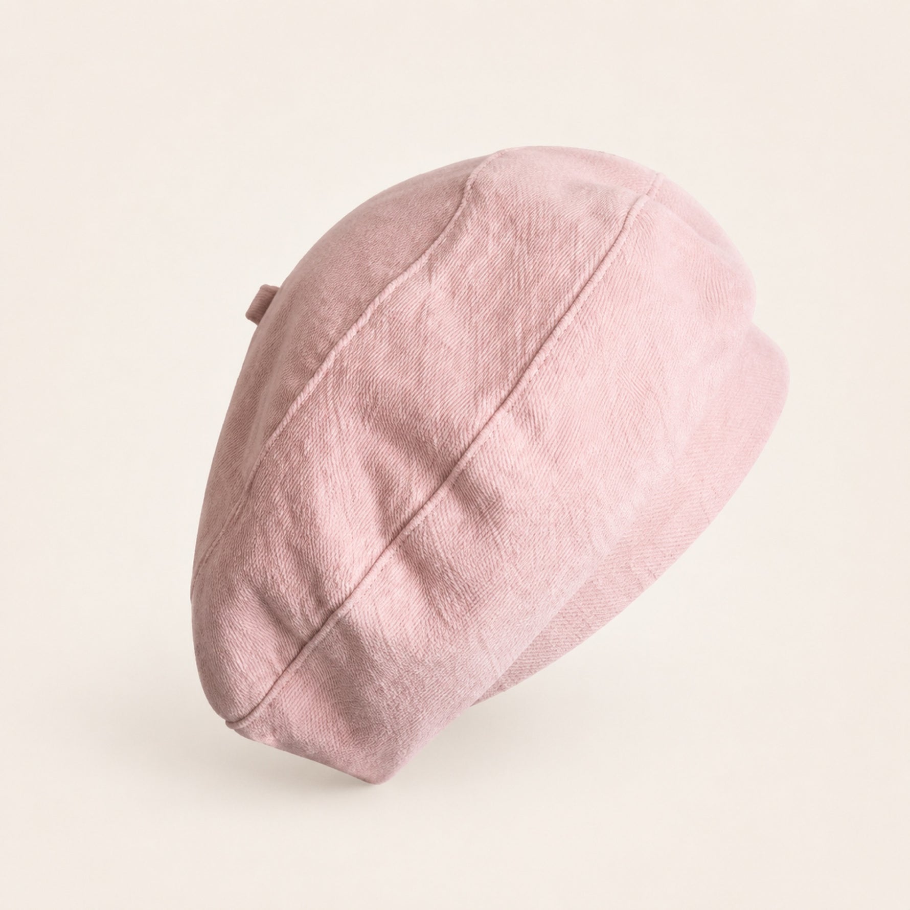 Woman wearing light pink cotton linen French beret