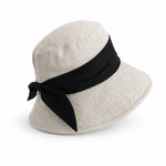 Cotton linen wide-brim bucket hat with black bow, natural flax body, UPF 50+ sun hat