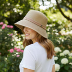 Woman wearing Straw Bucket Hat with Linen Band, back view in garden