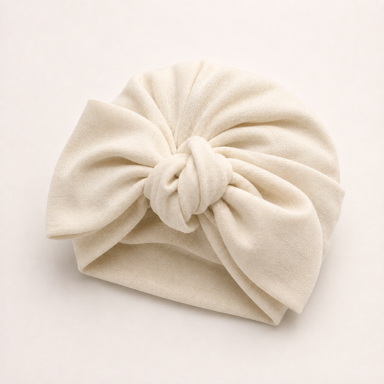 Beige modal cotton turban hair wrap with a matching statement bow