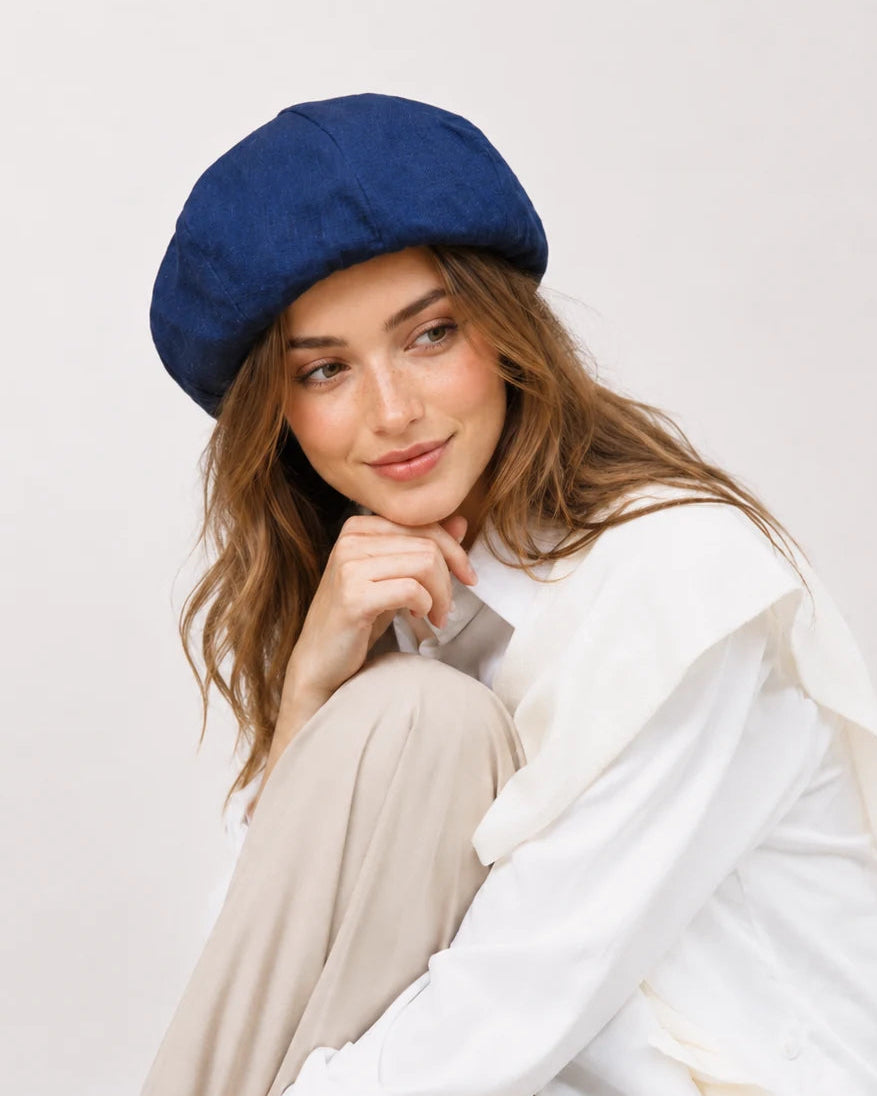 Woman wearing navy linen French beret
