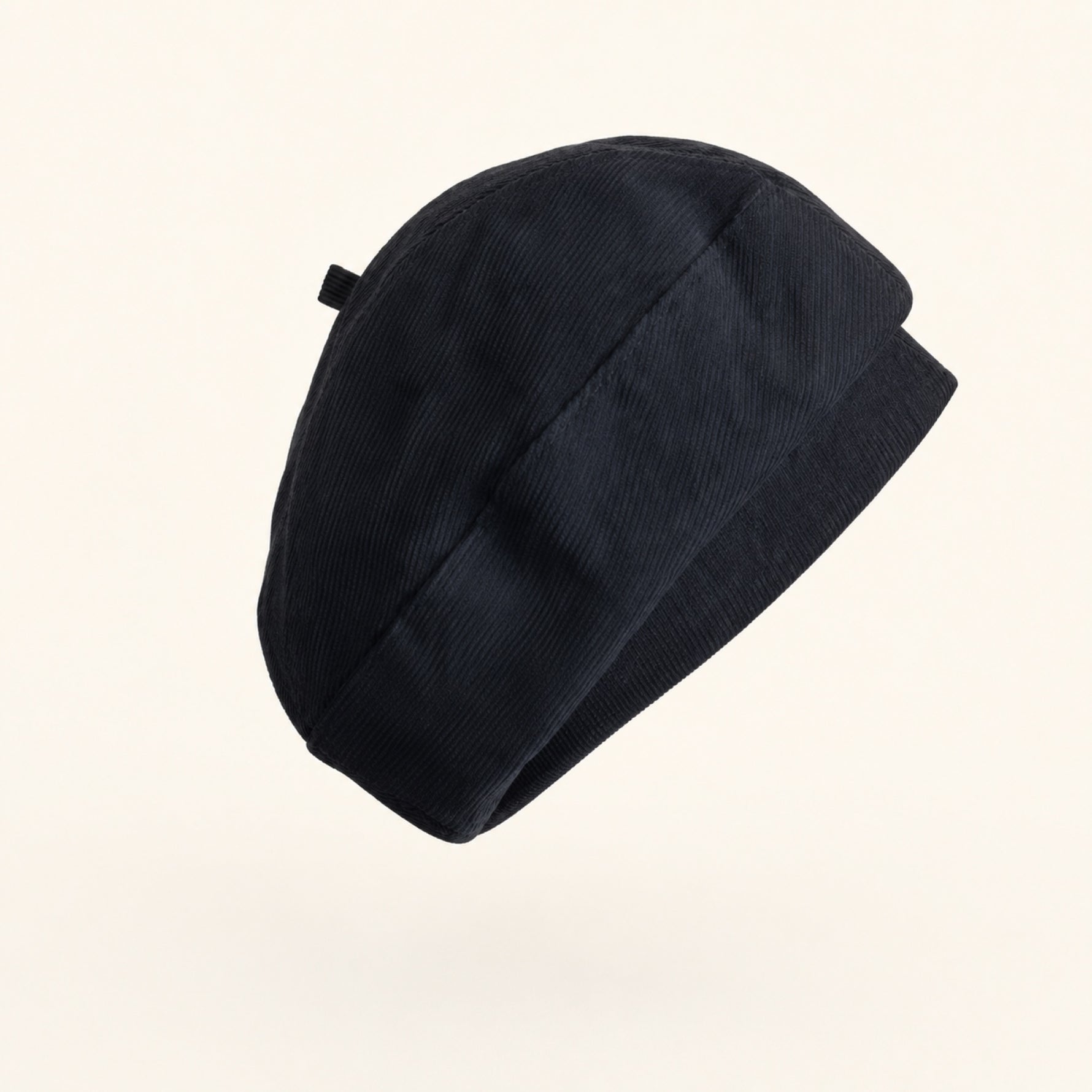 Woman wearing black cotton linen French beret