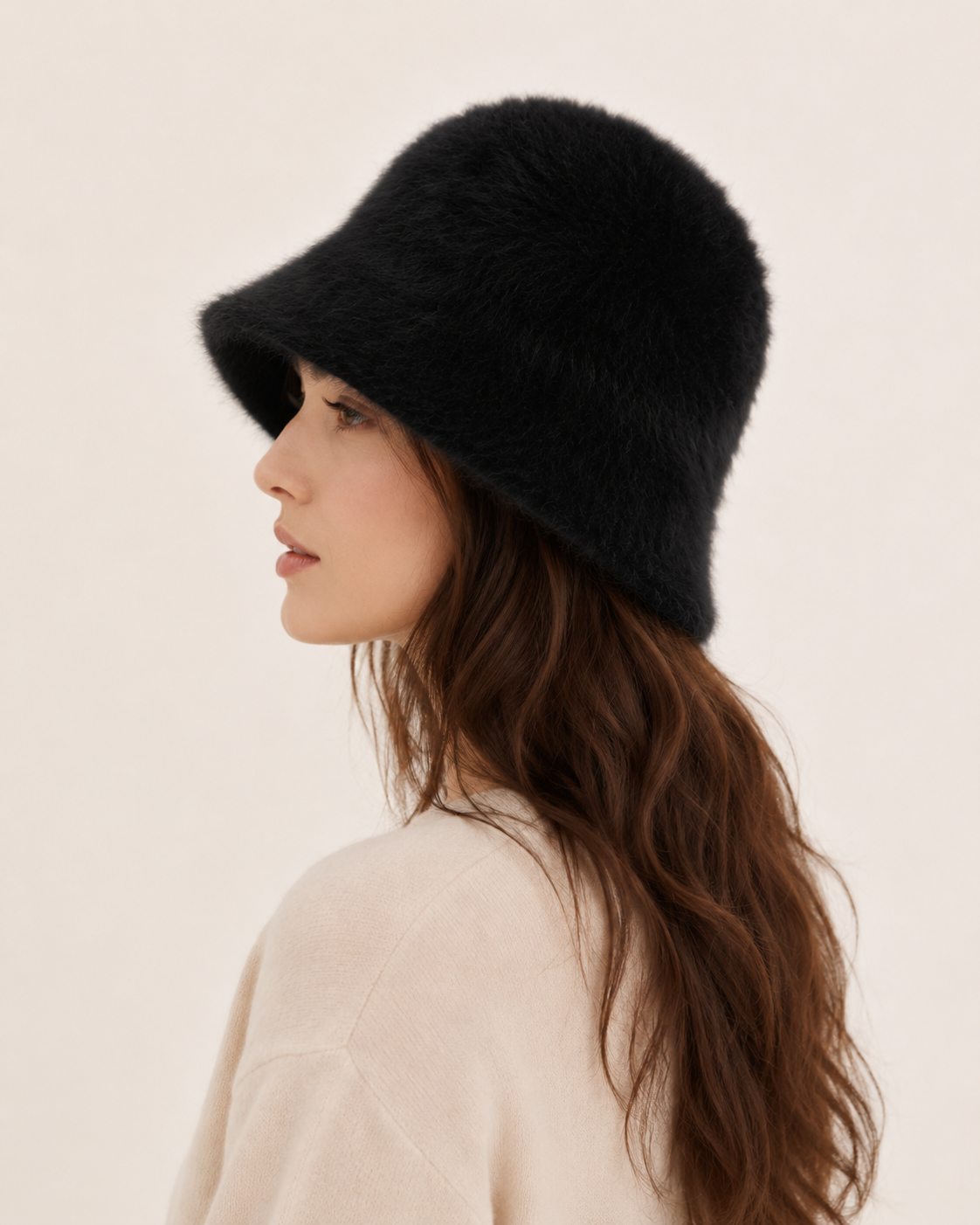 Classic black rabbit-hair blend bucket hat on a woman, side profile