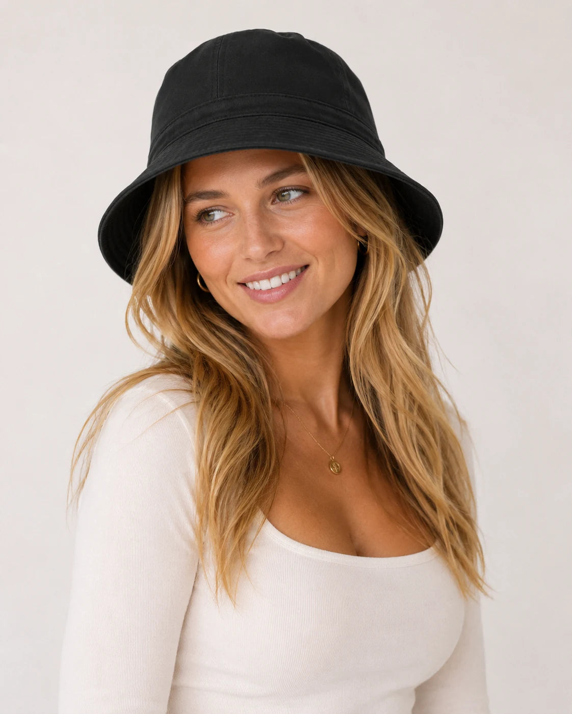 Woman wearing black cotton bucket hat