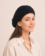 Woman wearing black cotton linen French beret
