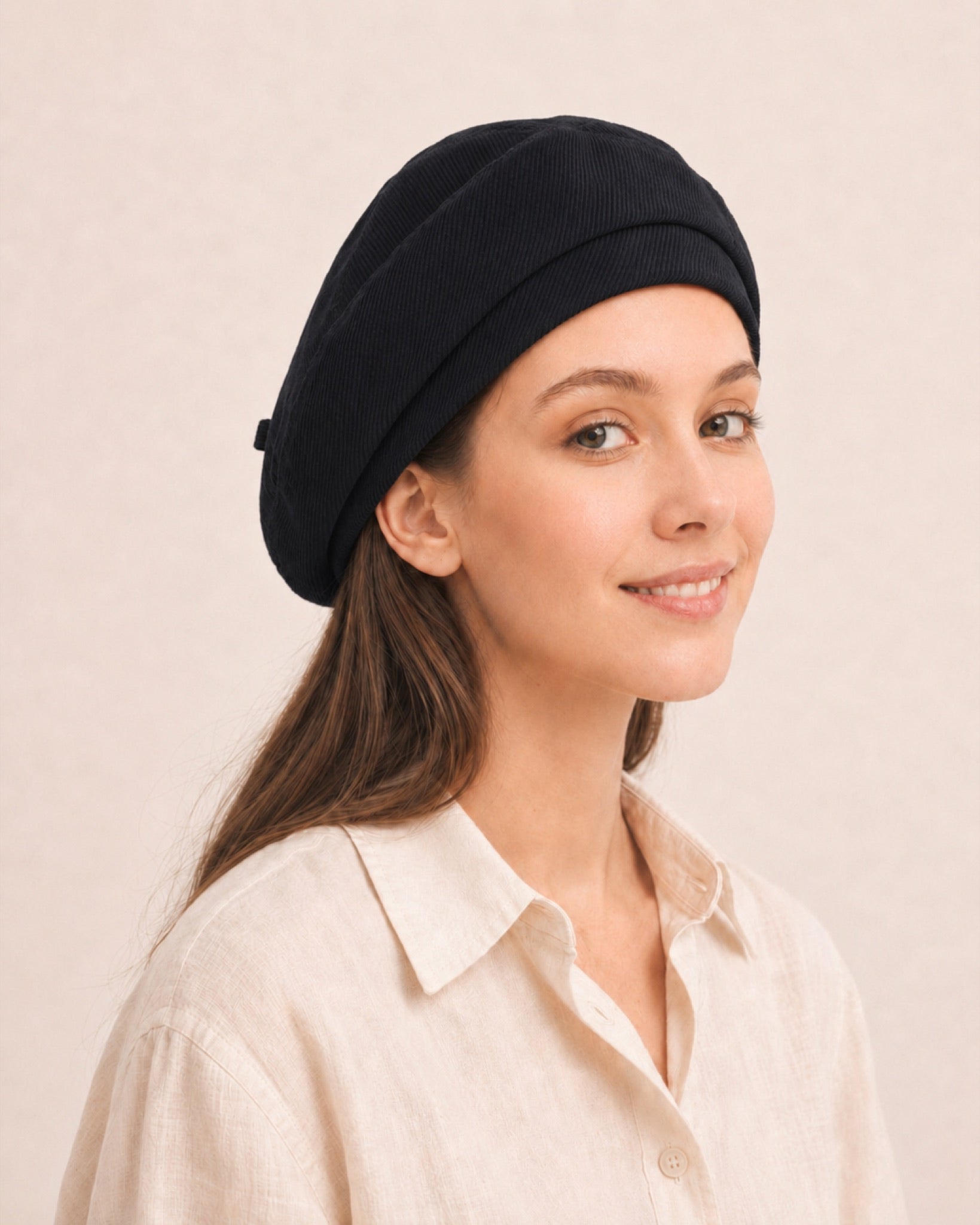 Woman wearing black cotton linen French beret