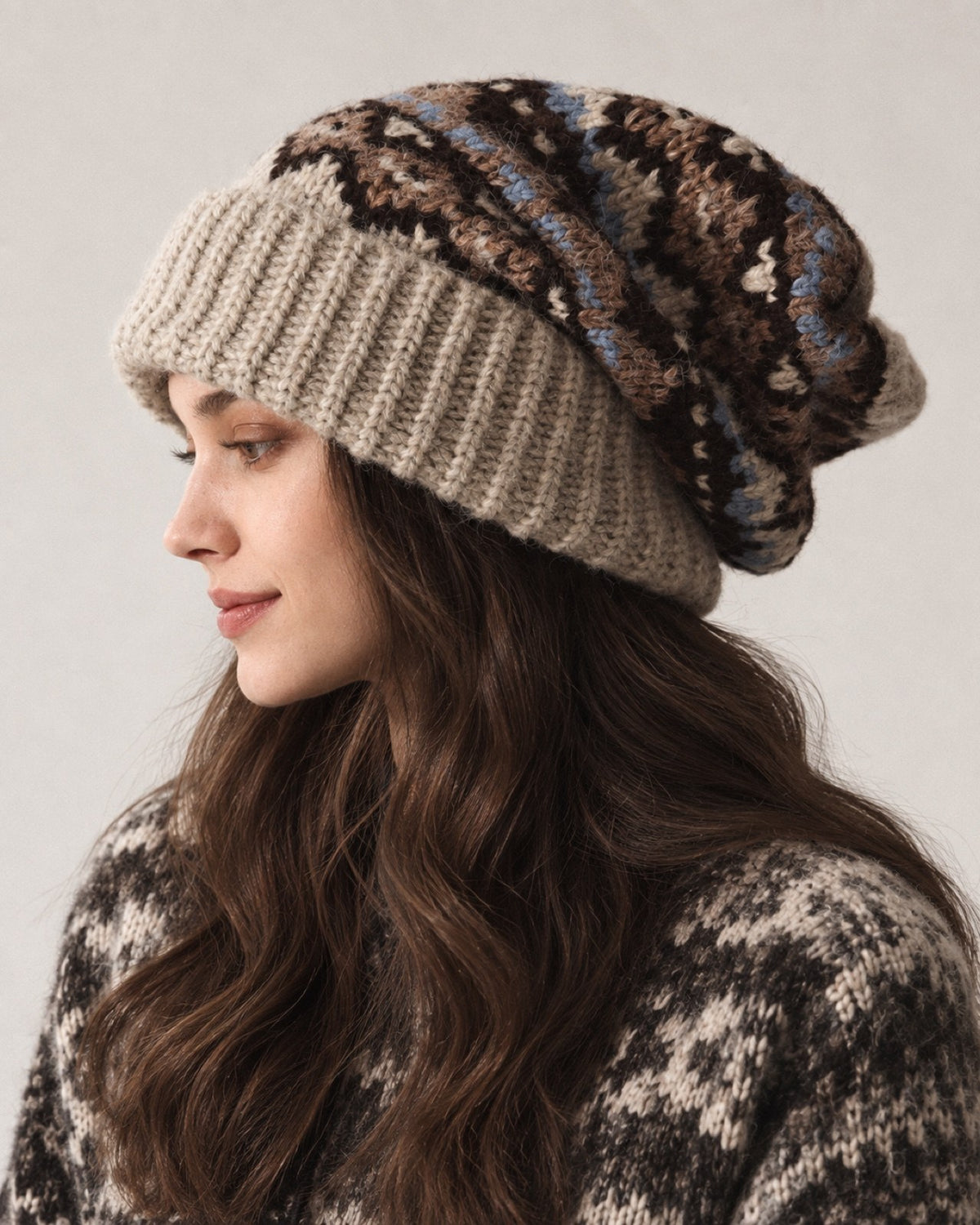Young woman wearing the Khaki Fair Isle oversized slouchy beanie, side studio portrait