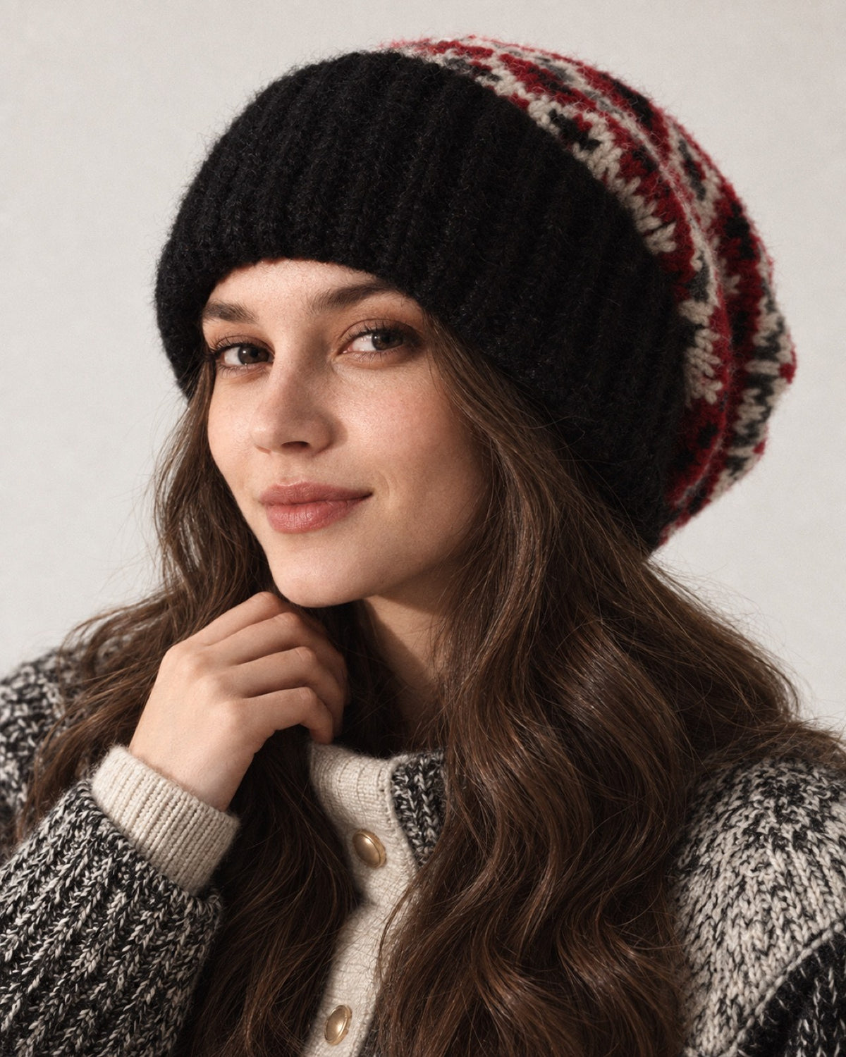 Young woman wearing the Black Fair Isle oversized slouchy beanie, front studio portrait