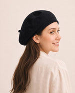 Woman wearing black cotton linen French beret