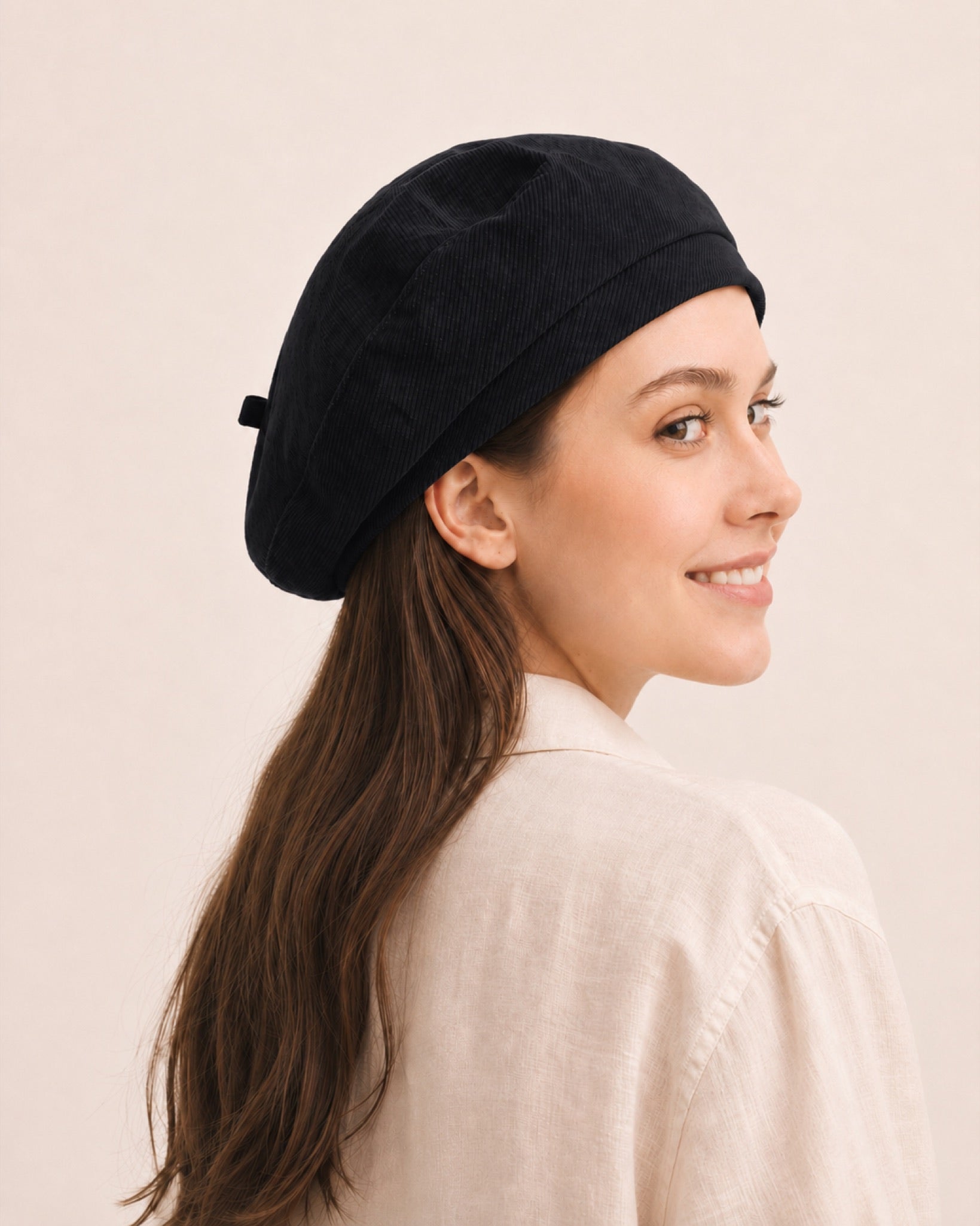 Woman wearing black cotton linen French beret